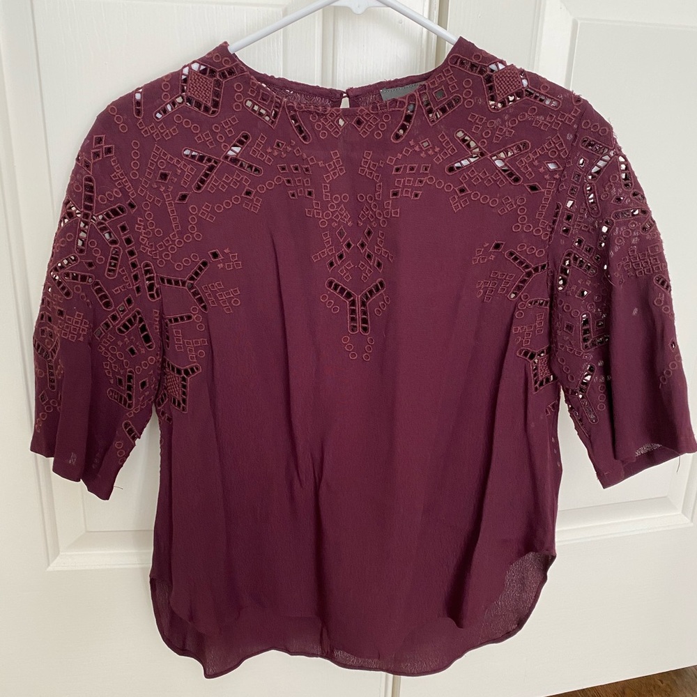 Maroon colored shirt with cutout details
